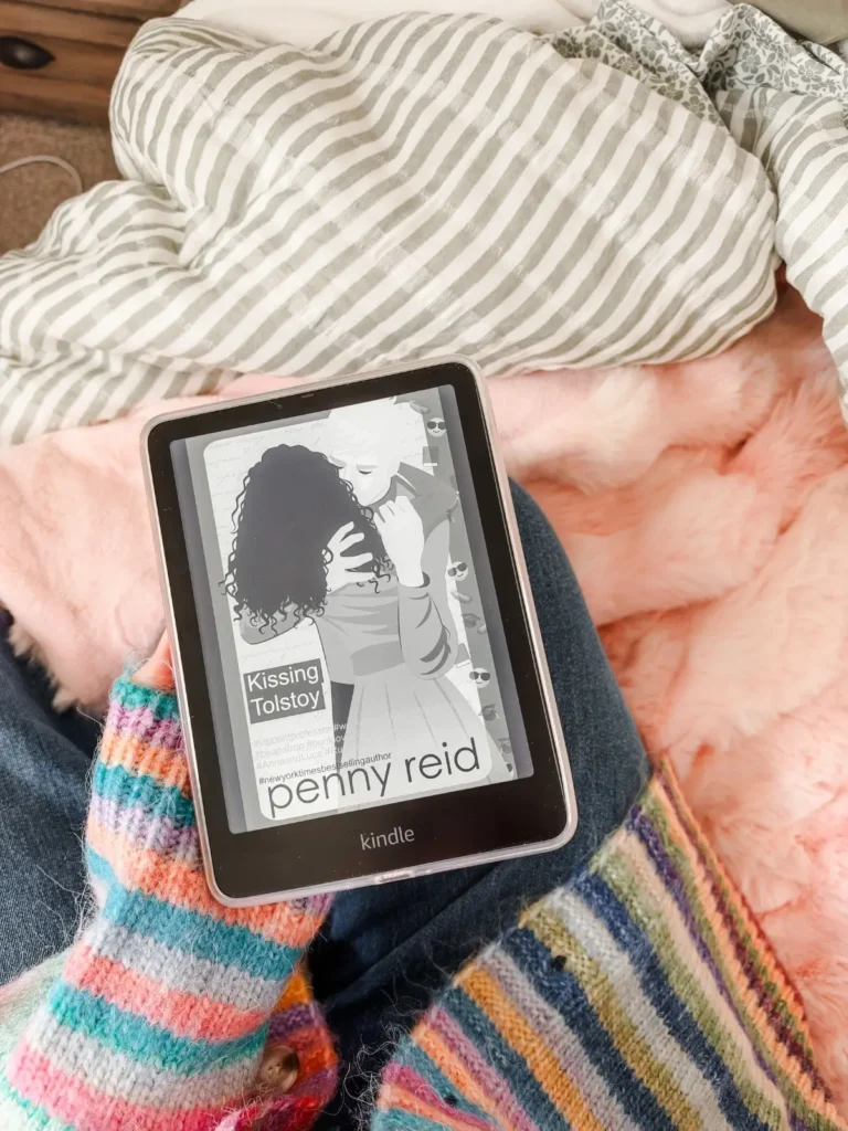academic romance kissing Tolstoy by penny reid on reader on bed