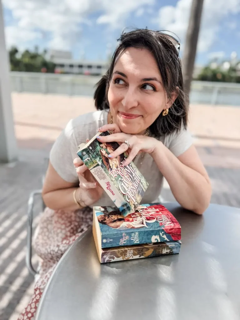 Francesca with vintage Lisa Kleypas paperbacks