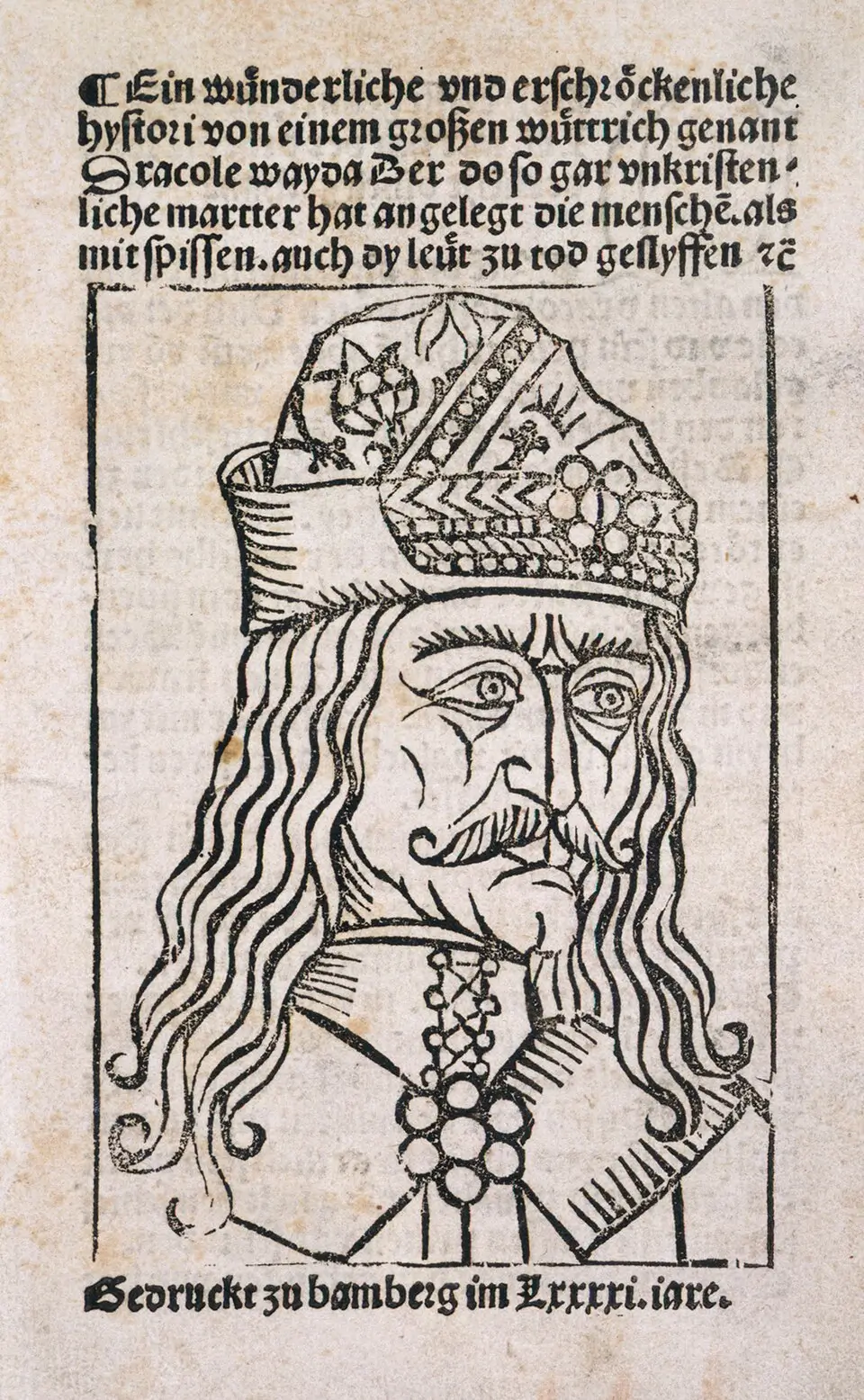 A woodcut portrait of Vlad III in a jeweled cap, with long hair and a heavy mustache, under a block of German blackletter text, from a 1491 pamphlet printed in Bamberg.
